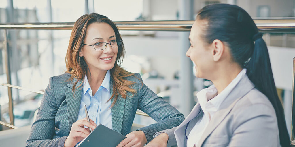 Business owner reviewing and giving specific feedback on a piece of content with their fractional marketing partner to refine brand voice and strategy