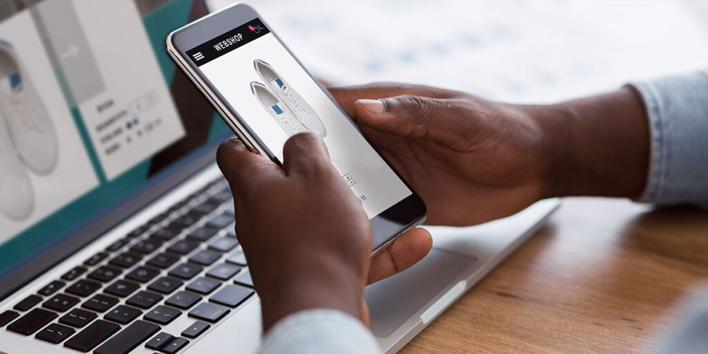 Ontario small business owner testing their website on a smartphone to check mobile responsiveness and ease of navigation