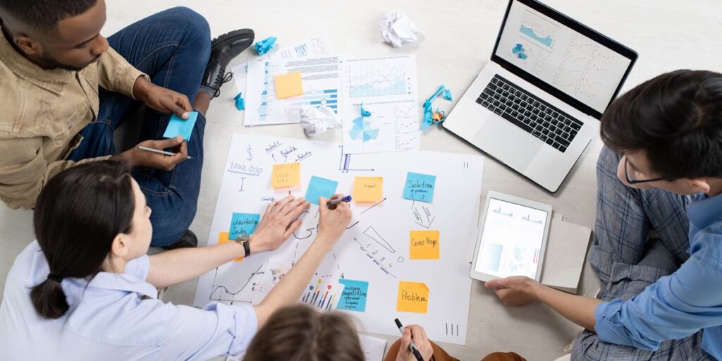 Ontario small business owner mapping out a content repurposing plan across social media, email, and blog channels on a laptop