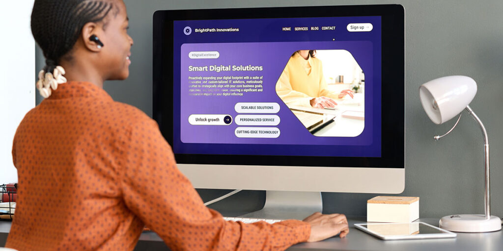 Business owner evaluating website structure and design on a desktop screen, distinguishing between surface-level updates and foundational issues